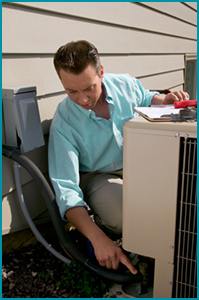 HVAC contractor tuning an air conditioning unit.